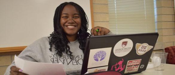 e-stem student at desk with laptop